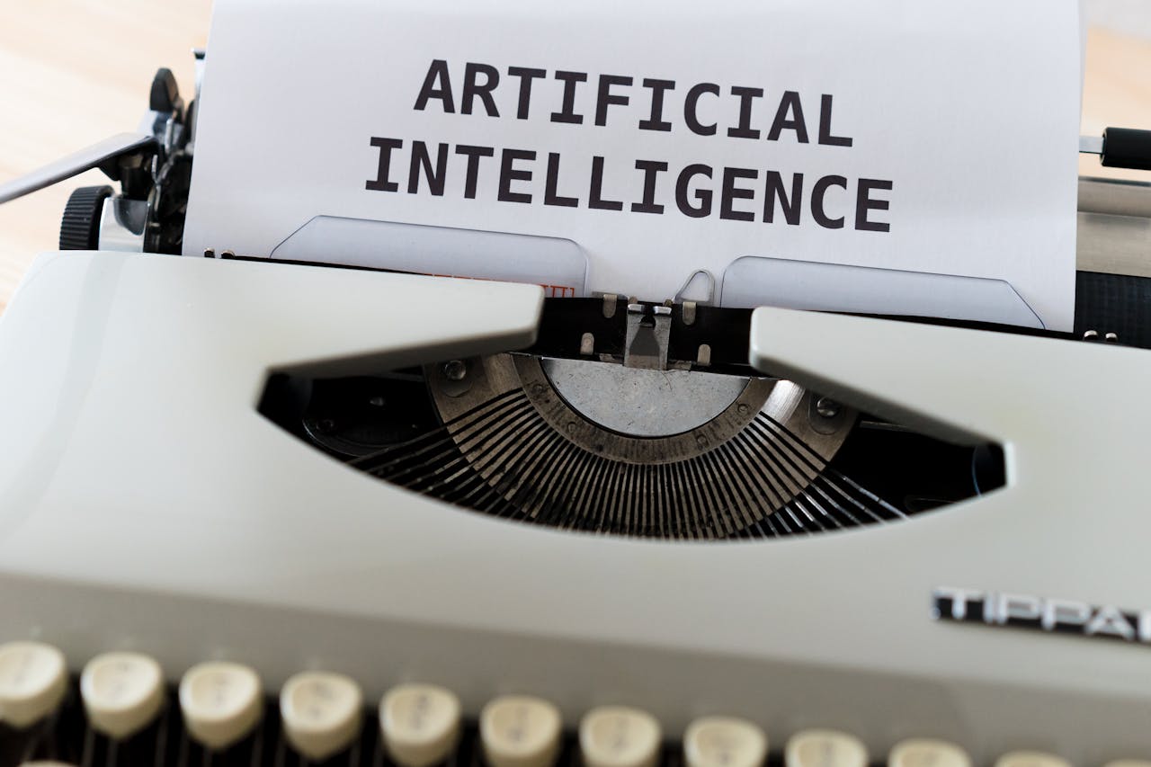 A close-up of a typewriter showcasing ARTIFICIAL INTELLIGENCE on paper.